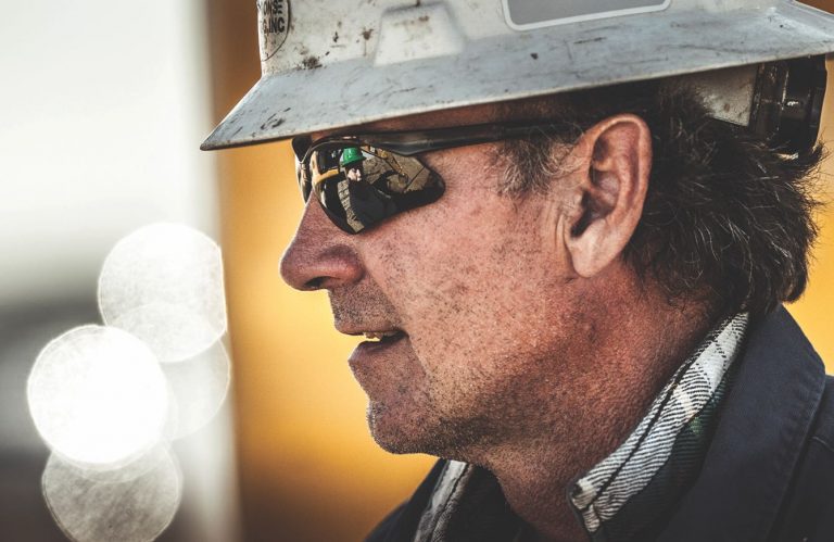man in a hardhat and sunglasses