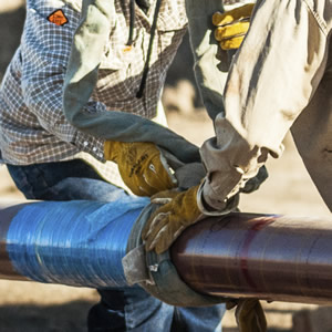 workers on pipeline