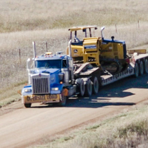 Semi truck carrying heavy machinery